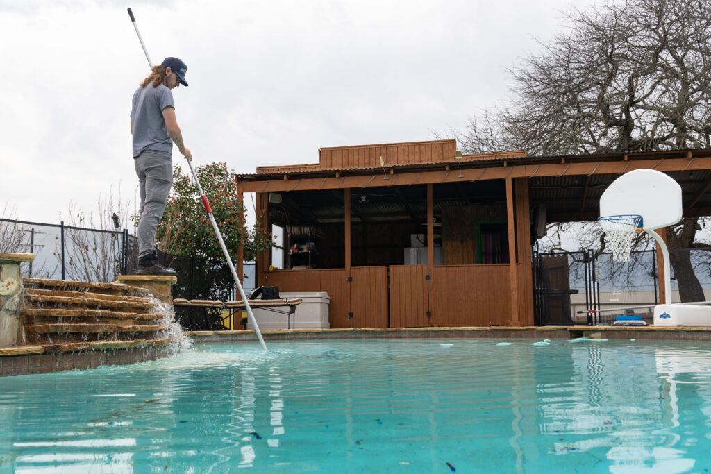 Experienced team providing Pool Maintenance in Dalworthington Gardens, TX while performing routine pool cleaning and water balancing