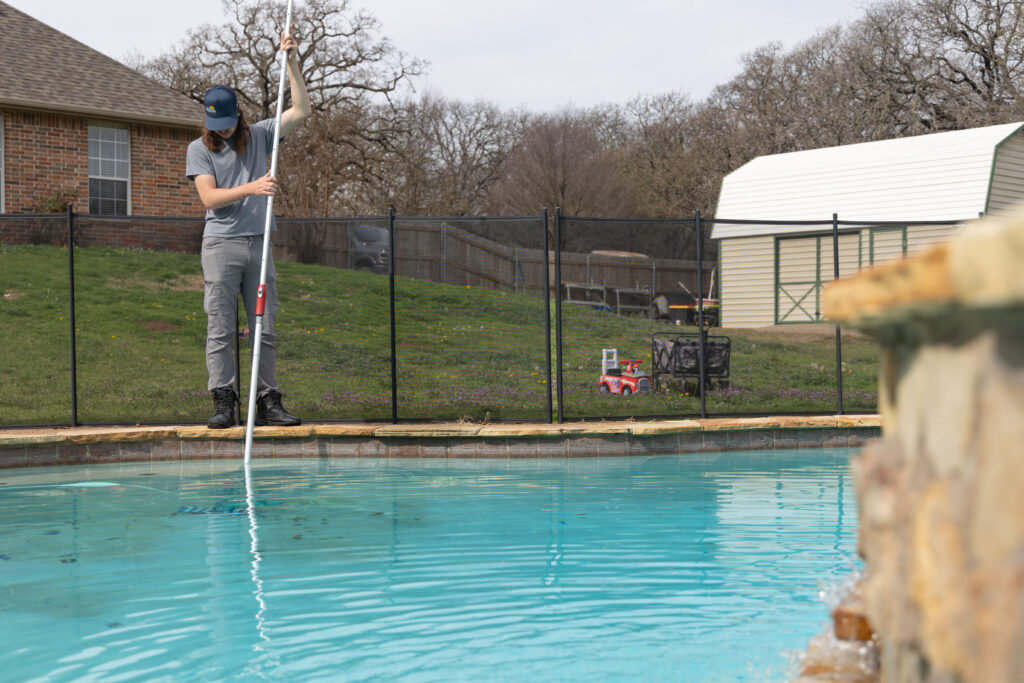 Skilled team delivering pool maintenance services in Briaroaks, TX, including chemical treatment and equipment inspections